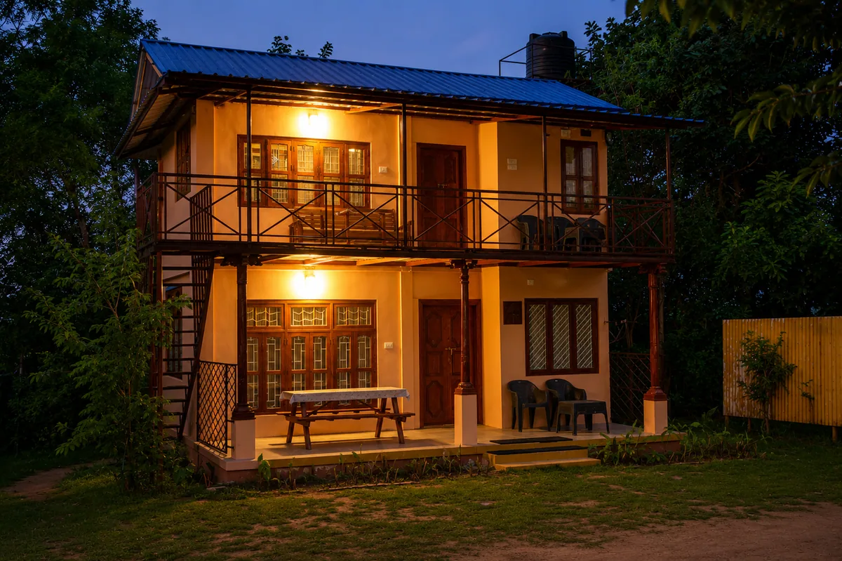 AranyaSun with its rooms lit in the last light of the evening