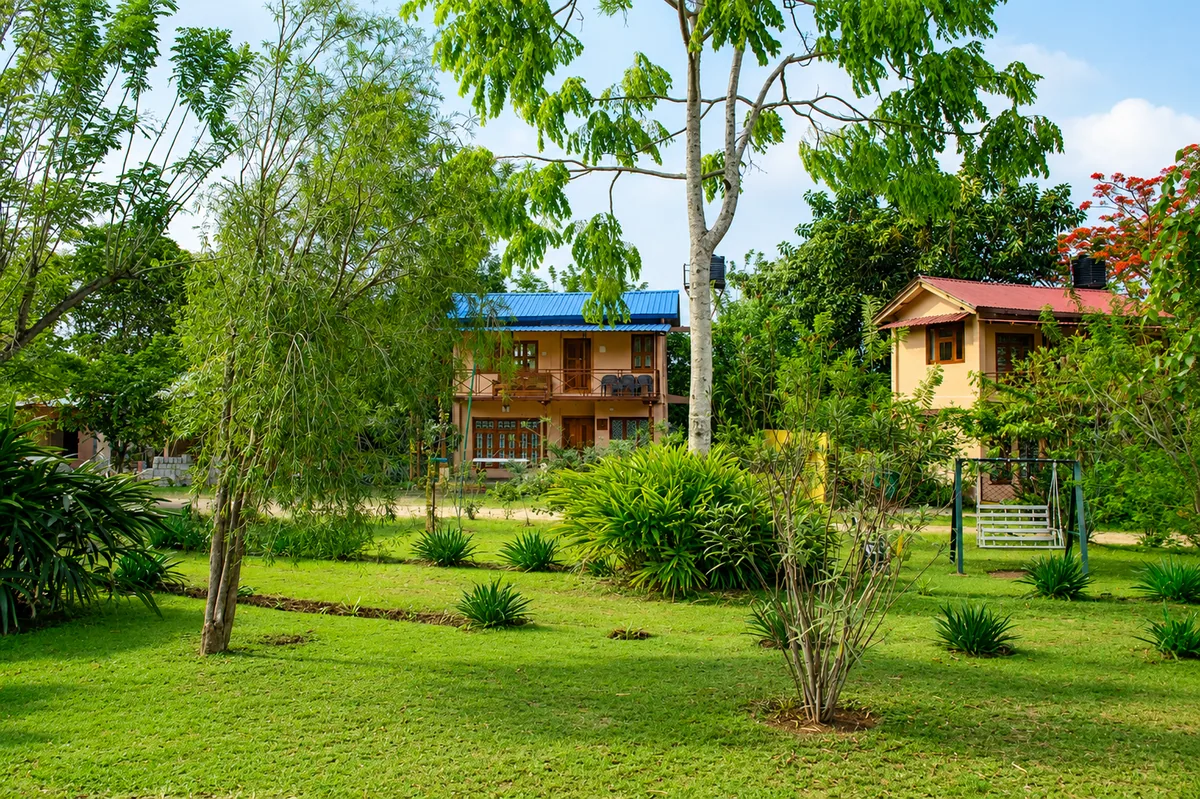 Lawn and garden planting between the cottages at Aranyasun